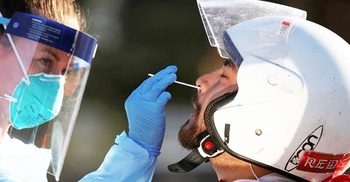 Australia reports jump in daily new cases, record deaths