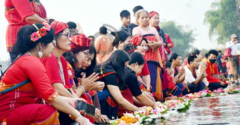 নদীর জলে ভাসলো বিজু ফুল