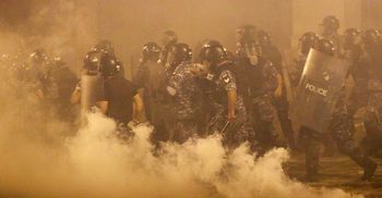 Beirut police fire tear gas as protesters regroup and 2 ministers quit