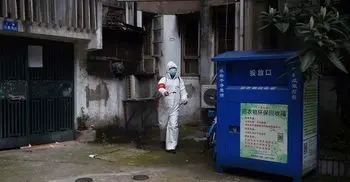 China reports 44 new virus cases as spread continues to slow at epicenter