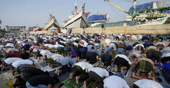 Muslims mark Eid al-Fitr holiday with joy, worry