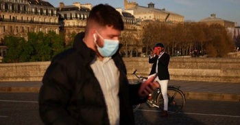 France eases mask rules; will end nightly virus curfew