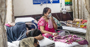 India says infections ‘slowing down’ as it passes 20 million cases