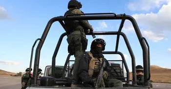Suspected cartel shootout kills 19 in northern Mexico