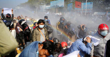 Myanmar police fire into the air, use water cannons to quell protests
