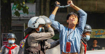 Myanmar police crackdown on protests; one woman killed, media say