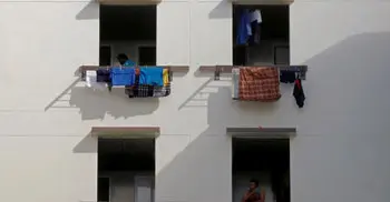 Singapore rushes to build housing for 60,000 migrant workers after virus outbreak