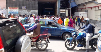 Garment workers block road in Mirpur demanding due salary