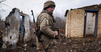 Ukraine imposes state of emergency, summons citizens home