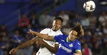 Militao takes Real Madrid top of La Liga, Atletico scrape win