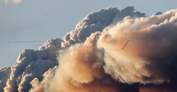 Canadian wildfire edges south, leaves thousands stranded