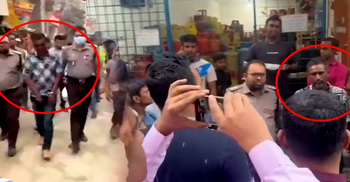চাঁদাবাজকে হ্যান্ডকাফ পরিয়ে বাজারে ঘুরালো পুলিশ