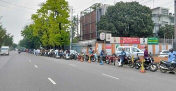 ঈদের দিনও তেল নিতে দীর্ঘ লাইন