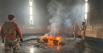 Syrian rebels put tomb of Assad's father on fire