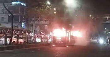 Bus on fire outside LabAid Hospital in Dhanmondi