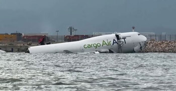 2 killed as cargo plane skids off Hong Kong runway into sea