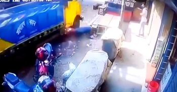 মোটরসাইকেল চাপা দিয়ে দোকানে ঢুকে গেলো ট্রাক