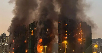 Four dead, dozens feared trapped as fire sweeps Hong Kong high-rises