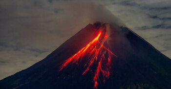 Indonesia volcano erupts, spews hot lava and smoke