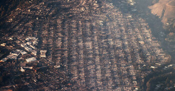 Los Angeles investigates fire blame as curfew enforced