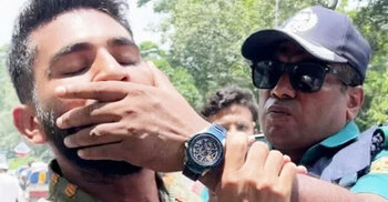 Cop pictured gagging protester face suspension