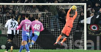 Milan secure last-gasp win at Udinese after game interrupted by racist chants