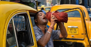 'Hotter and hotter': Swathes of Asia sweat in heatwave