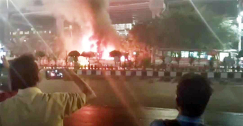 Bus torched in front of police outpost in Dhaka