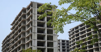 China vows to support property sector, tackle local debt