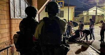 Gunmen kill 15 police, a priest in attacks in Russia