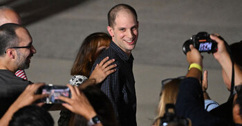 Russia frees US reporter in huge prisoner swap with West