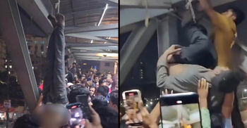 2 suspected snatchers hung upside down, beaten