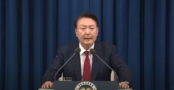 South Korea’s impeached president resists arrest over martial law bid