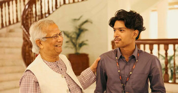 Yunus hands over Purbachal plot deed to Sagar-Runi’s son, Megh