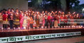 মোমবাতির আলোয় সহিংসতার প্রতিবাদ