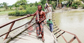 ৮ মাস ধরে ঝুলছে ভাঙা কাঠের ব্রিজটি, বাধ্য হয়েই পারাপার