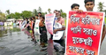 কোমর পানিতে নেমে জলাবদ্ধতার প্রতিবাদ