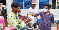 মাস্ক পরিয়ে হাতে দিচ্ছেন সাবান-স্যালাইন