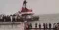 Woman’s body found, dozens feared trapped in sunken bus