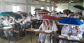 শ্রেণিকক্ষে ছাতা মাথায় ক্লাস