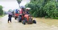 দুর্গত এলাকায় যাতায়াতের একমাত্র ভরসা ট্রাক্টর