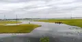 সুনামগঞ্জে রোদের দেখা মিললেও হাওরে কাটেনি বন্যার শঙ্কা