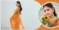 স্লিভলেস ব্লাউজ আর কমলা শাড়িতে মায়াবী সাদিয়া