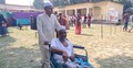 ছেলের সাহায্যে হুইলচেয়ারে এসে ভোট দিলেন গিয়াস উদ্দিন